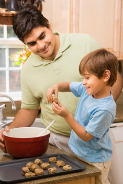 Dad and son making cookies