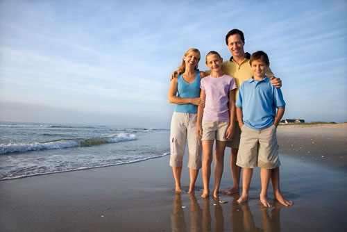 Smiling family on beach