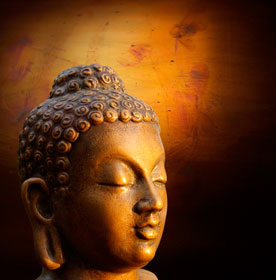 Head of Budha on golden background